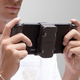 The Enerjoy battery magnetically attached to the back of the Switch.